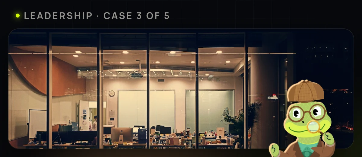 An office still lit late at night, one person still inside